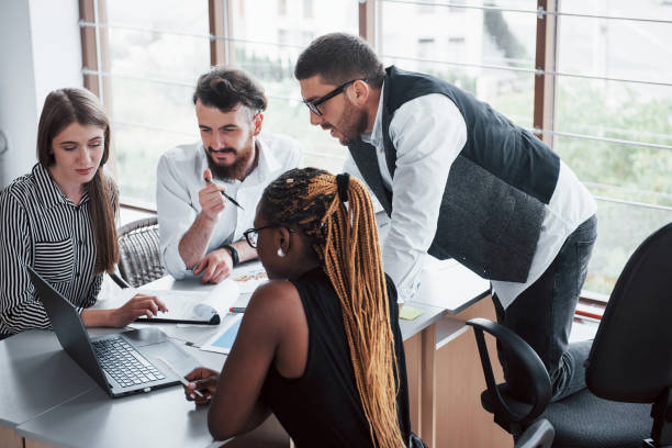 istock A group of multinational busy people working in the office 1137031987