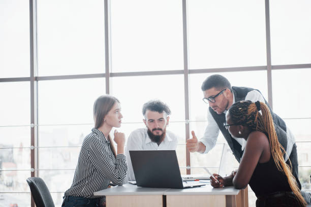 istock A group of multinational busy people working in the office 1137032359