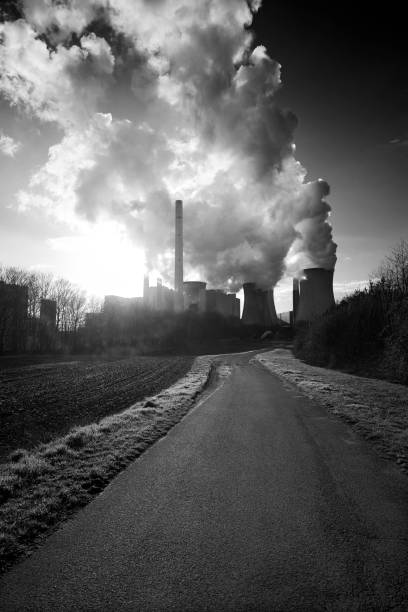 istock Small road and coal fired power plant with pollution 1137032389
