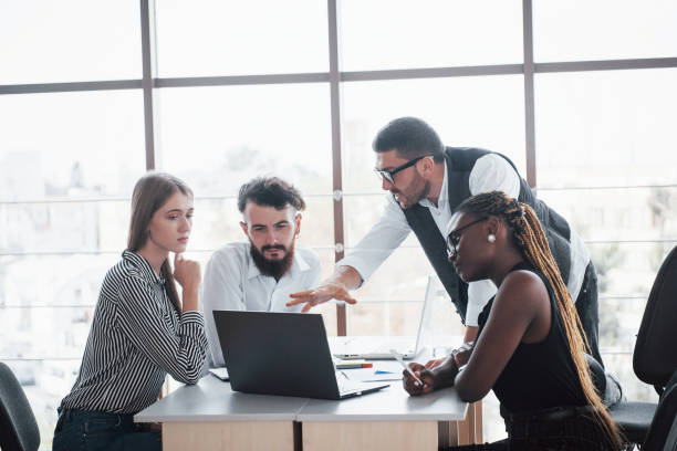 istock A group of multinational busy people working in the office 1137032594