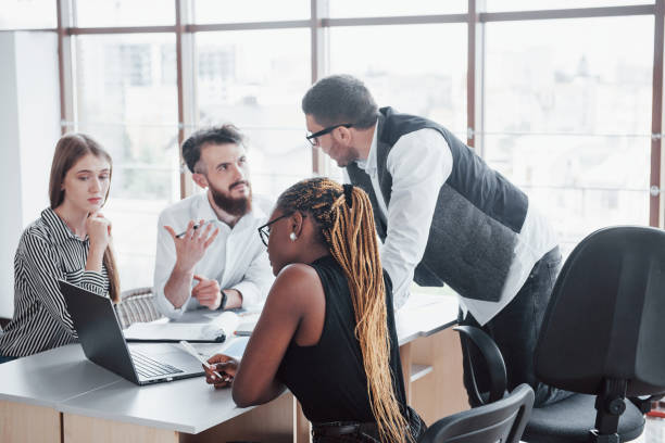 istock A group of multinational busy people working in the office 1137032656
