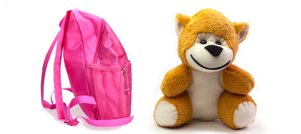 istock school backpack for girls and monkey toy. 1137034301