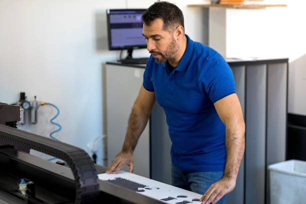 istock Hispanic mature man working in printing office 1137036020