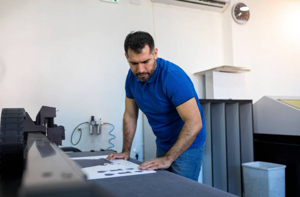 istock Hispanic mature man working in printing office 1137036697