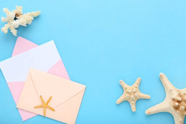 istock Paper envelopes and starfishes on blue background 1137036795
