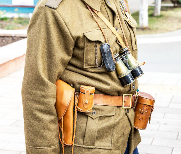 istock Vintage leather holster, binoculars and other ammunition on the belt 1137040233
