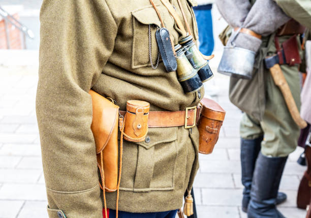 istock Vintage leather holster, binoculars and other ammunition on the belt 1137040240
