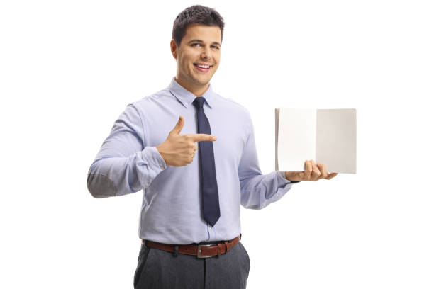 istock Young professional man holding a notebook with blank pages and pointing 1137040518
