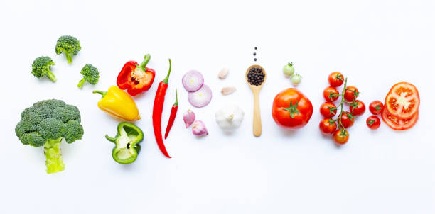 istock Various fresh vegetables and herbs on white. Healthy eating concept 1137041482