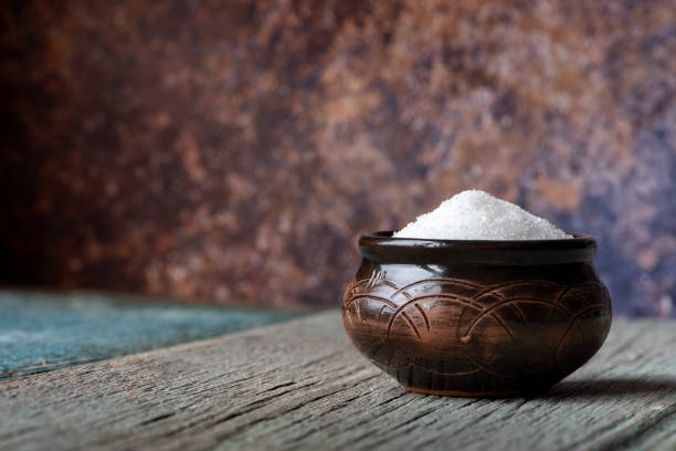 istock Sugar in a bowl on a wooden table 1137041485