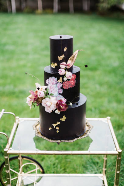 istock Black wedding cake with flowers 1137041914