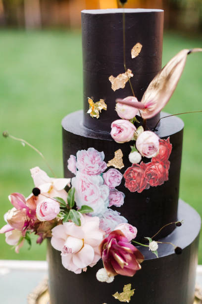 istock Black wedding cake with flowers 1137041917