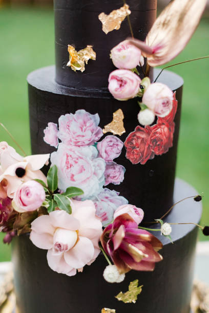 istock Black wedding cake with flowers 1137041979
