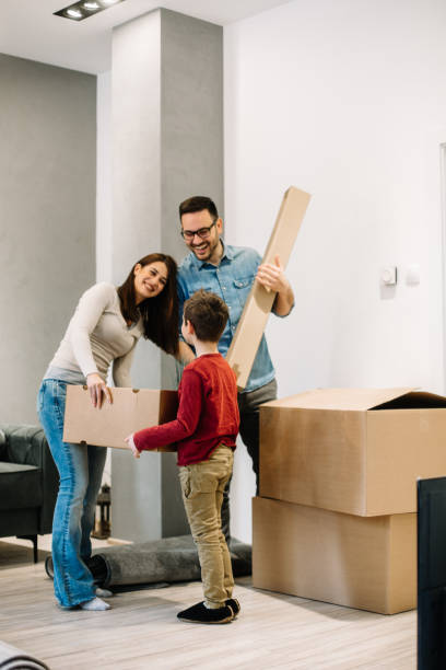 istock Happy parents talking to their son while moving into new home. 1137042204