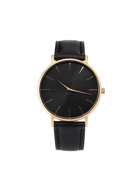 Classic women gold watch black dial, leather strap, isolate on white background Classic women's gold watch with a black dial, leather strap, isolate on a white background. Front view. belt leather isolated close up stock pictures, royalty-free photos & images