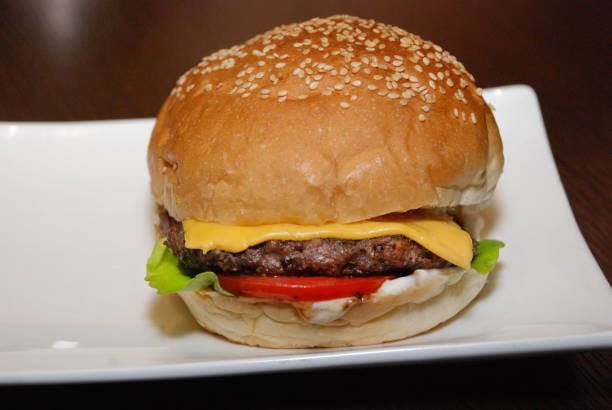 istock Single chicken beef burger on the white plate 1137043779