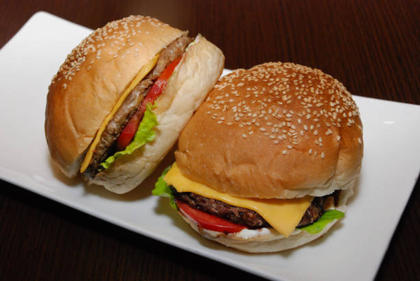istock Two burgers with cutlet and cheese on the white plate 1137043824