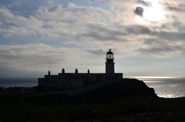 Beautiful Neist Point Lighthouse at dusk in Scotland.