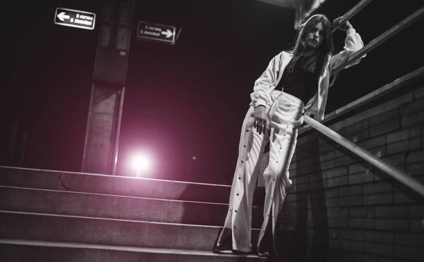 istock Young woman posing on a railroad station 1137043895