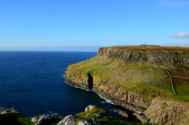The Scottish Highlands with amazing sea cliffs, moors and rolling hills.