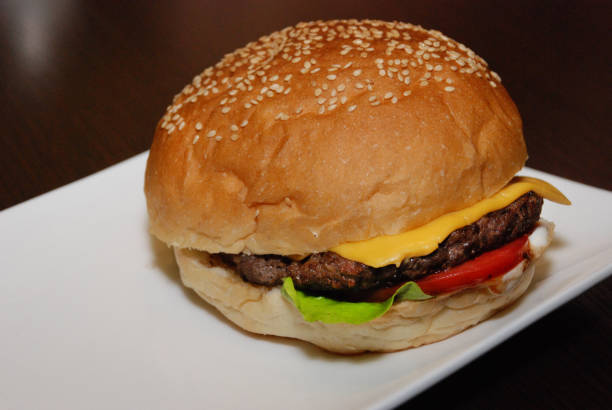 istock Single chicken beef burger on the white plate 1137044255