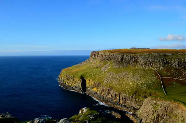 Gorgeous sea cliffs and blue waters at the base of Neist Point.