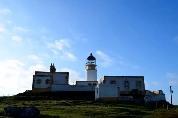 Neist Point lighthouse on the rugged coast of the Isle of Skye.