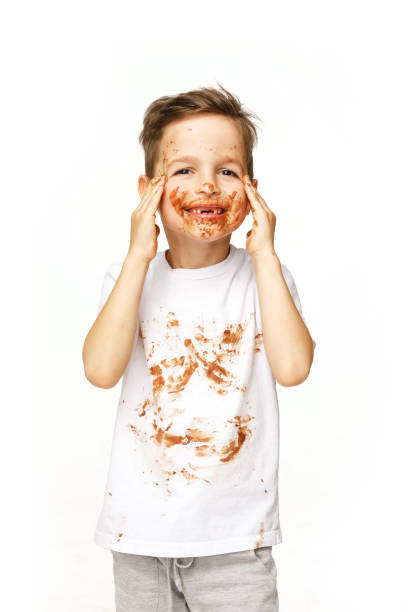 istock little boy with face and hands in chocolate 1137044450
