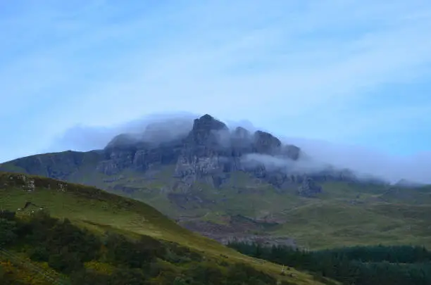 The Scottish Highlands with the hills covered in clouds.