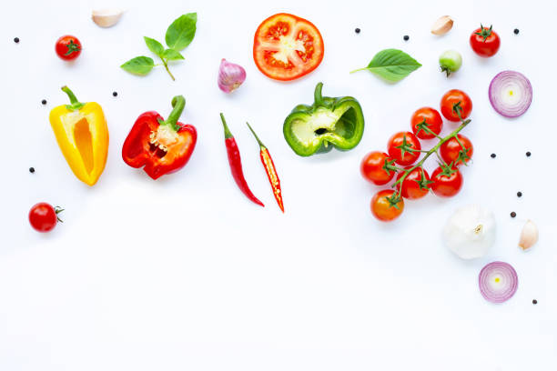 istock Various fresh vegetables and herbs on white. Healthy eating concept 1137045059