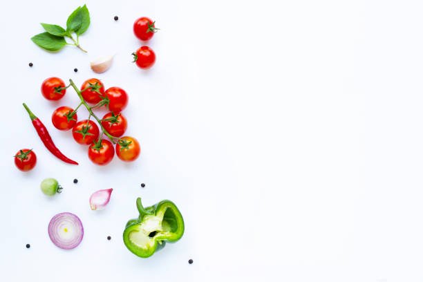 istock Various fresh vegetables and herbs on white. Healthy eating concept 1137045095