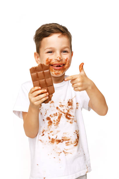 istock little boy with face and hands in chocolate 1137046790
