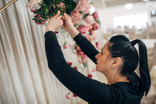 istock Lady arranging flowers before wedding 1137046900