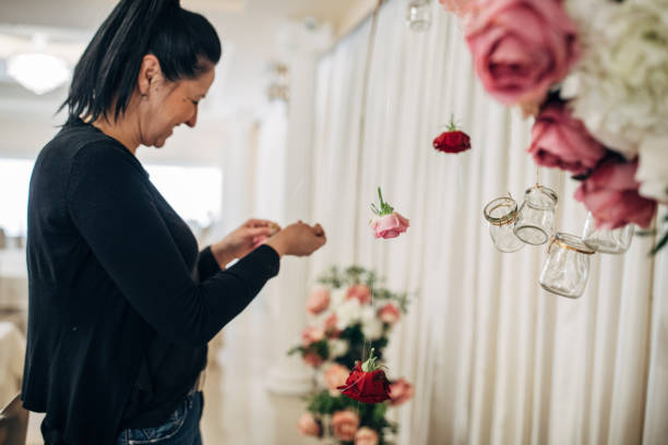 istock Lady arranging flowers for wedding 1137047112