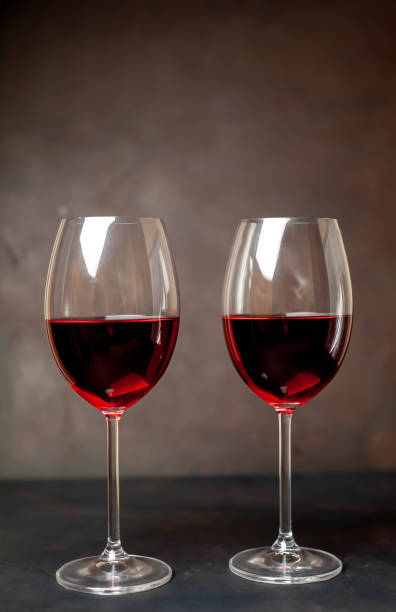istock Red wine glasses on the background stone 1137047180