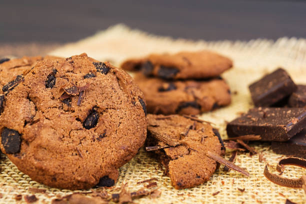 istock Cookies with chocolate on dark wooden background 1137048178