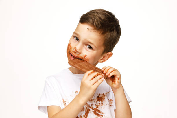 istock little messy boy is eating chocolate studio shot 1137050185