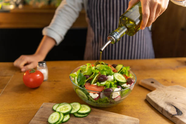 istock Pouring oil on salad 1137050217