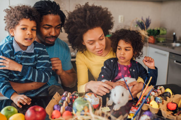 istock Family petting white rabbit 1137050442