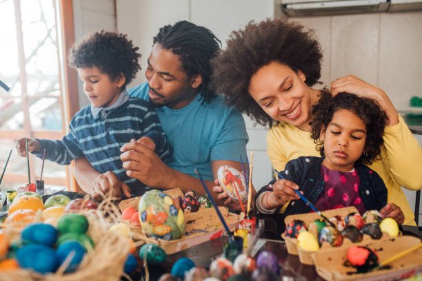 istock African-american family decorating Easter eggs 1137050507