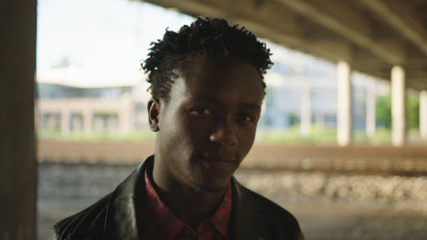 istock Young african ethnicity man looking at camera under bridge. Portrait 1137051379