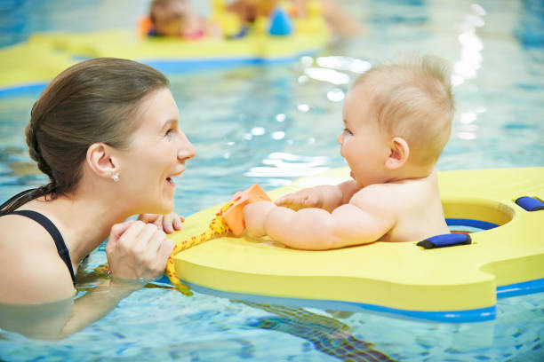 istock He’s enjoying her first dip in the pool 1137052682