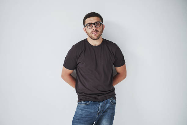 istock Young hipster guy wearing glasses laughing happily isolated on white background 1137054112