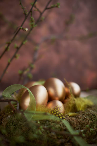 Arrangement for Easter with golden eggs, still life