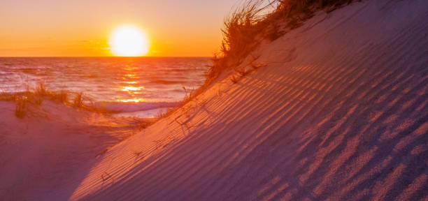 istock View of Sunset Over Sand Dunes on the Shore 1137057232