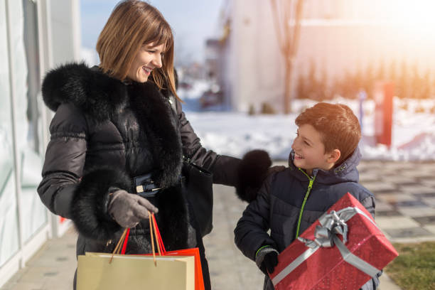 istock Happy mother and son in shopping. 1137057654