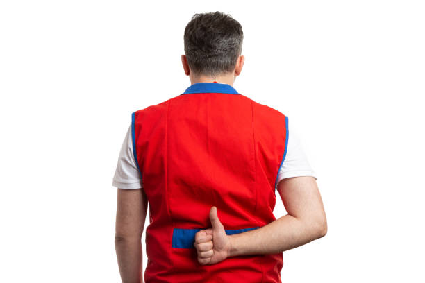 istock Worker at hypermarket holding thumb up behind back 1137058806