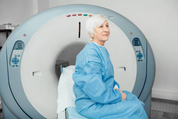 istock Pensive elderly woman sitting on scanner table. waiting for CT scan 1137059077