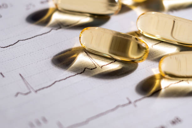 istock cardiogram and omega 3 pills. concept healthy heart 1137061630