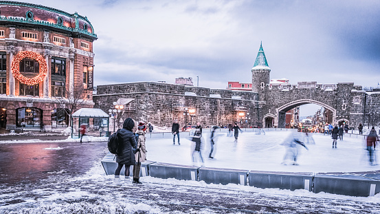 Toronto, Ontario, Canada- January 1sh, 2023:Ice skating in Nathan Phillips Square at night